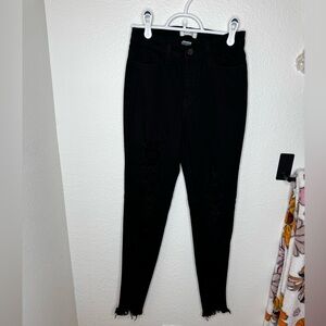 Distressed black stretchy jeans. Leggings.